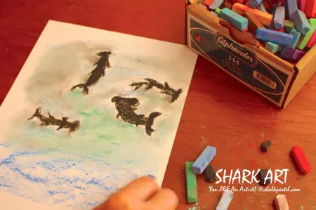 Nana brings the art fun with Sharks Video Art Lessons! All it takes is a starter set of chalk pastels, construction paper and Nana’s video art lessons for a celebration of Shark Week or to thrill your shark enthusiast. No expensive, intimidating list of art supplies. This set of Sharks Video Art Lessons is a wonderful stand alone art curriculum or a perfect complement to your summer fun or shark learning throughout the year.