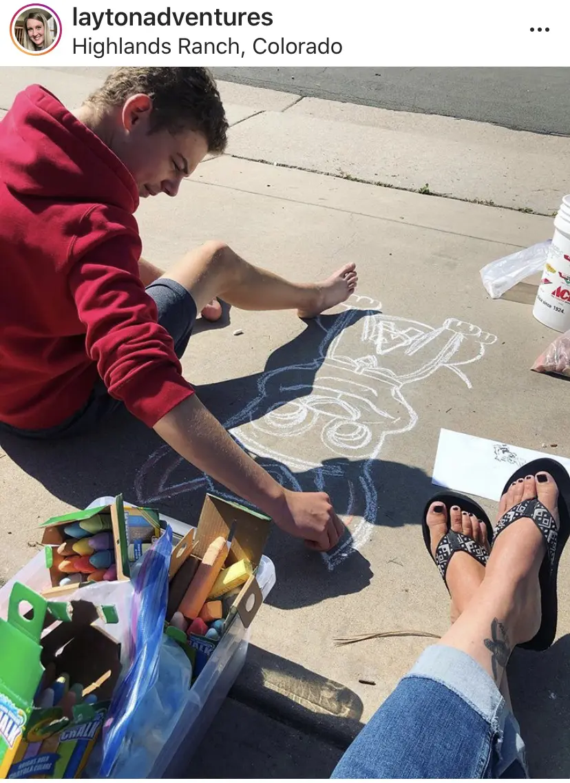 Chalking a 'thank you' message on our driveway for a 2yr old fan who checks our driveway every morning for a new picture. What raising an artist looks like. 